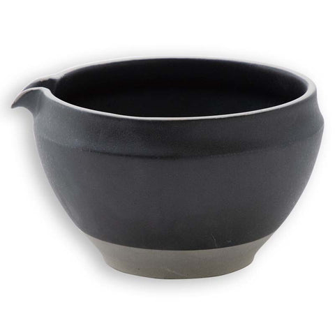 Black ceramic matcha bowl with spout, ideal for easy pouring and whisking Japanese green tea.
