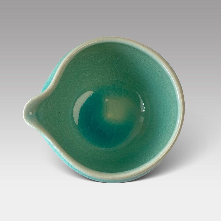 Top view of Blue Nagashi matcha chawan showing crackle-glazed teal interior and pouring spout, handcrafted in Japan