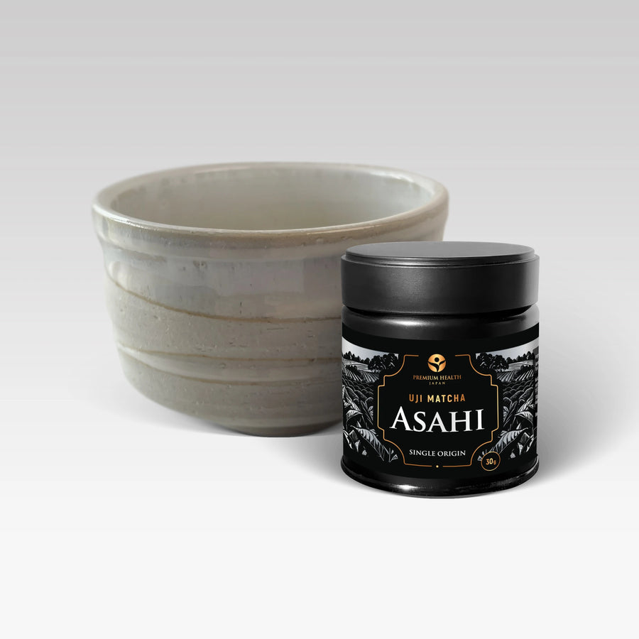 Uji Matcha Asahi single-origin 30 g can with ceramic chawan bowl, product styling on a light background.