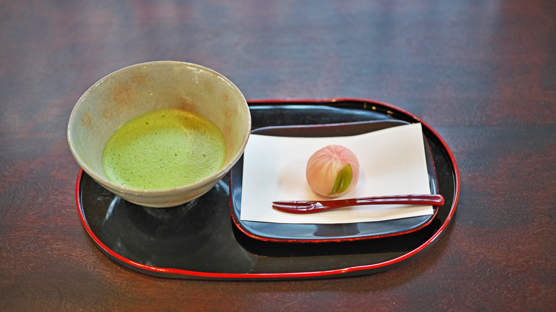 Bowl of matcha with a traditional Japanese sweet