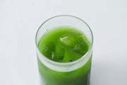 Glass of iced Asahi Uji matcha over ice — vivid green stone-ground green tea from Kyoto