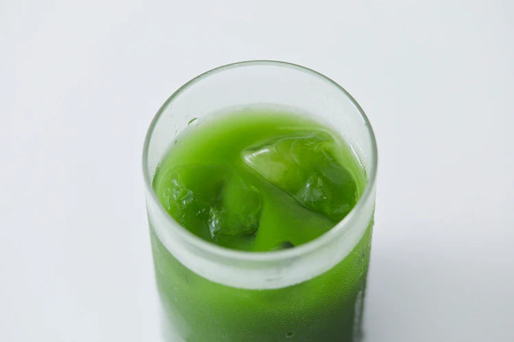 Glass of iced Asahi Uji matcha over ice — vivid green stone-ground green tea from Kyoto