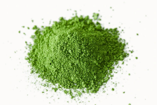 Mound of Asahi organic Uji matcha — vivid green stone-ground green tea powder from Kyoto