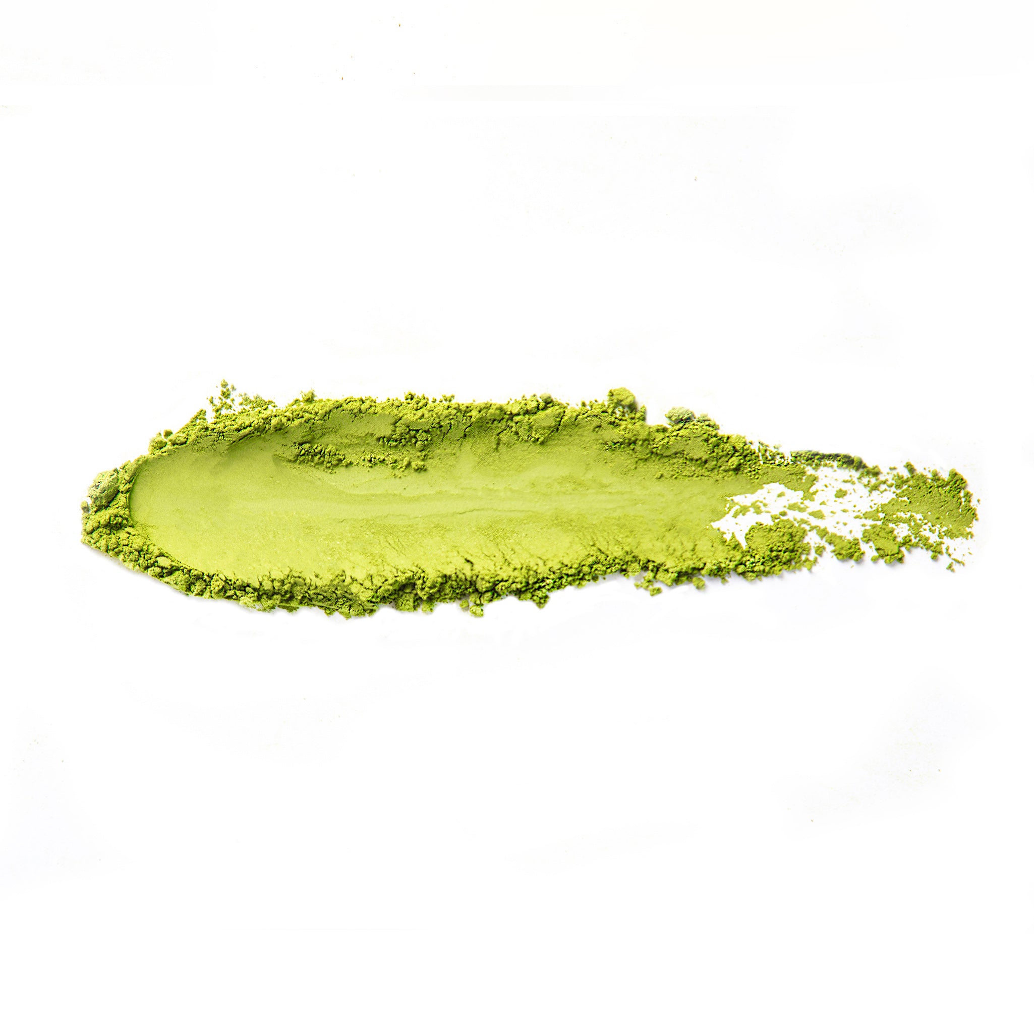 Fine matcha powder swept across a white background