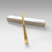 Suikaen bamboo chashaku tea scoop placed on elegant gift box, handcrafted in Takayama, Japan.