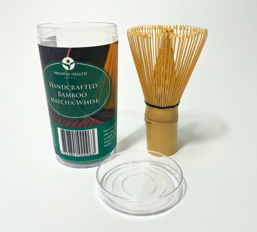 100-prong bamboo matcha whisk with clear cylindrical packaging labeled "Handcrafted Bamboo Matcha Whisk" by Premium Health Japan