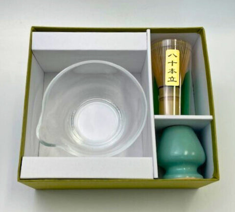 Glass matcha bowl set with spouted bowl, bamboo whisk, and turquoise whisk holder in green gift box