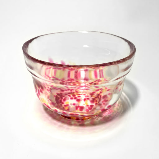 Handblown Japanese glass matcha bowl with pink sakura-inspired pattern, ideal for modern tea preparation and matcha display