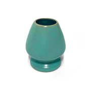 Japanese ceramic matcha whisk holder in green-blue glaze, designed to maintain chasen shape and prolong durability