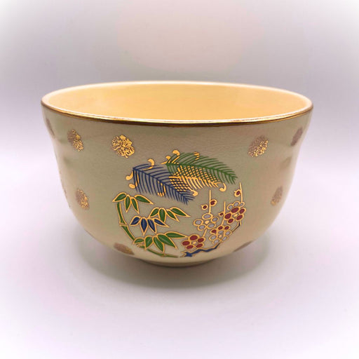 Handmade Japanese matcha bowl with traditional Shōchikubai pine bamboo plum motif inspired by Ninsei pottery