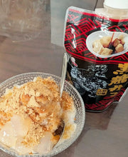 Japanese shaved ice dessert topped with Okinawa Brown Sugar Syrup (Kokuto Mitsu), served with traditional black sugar syrup and kinako soybean powder.