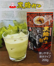 Iced matcha latte sweetened with Okinawa Brown Sugar Syrup (Kokuto Mitsu) alongside authentic Japanese black sugar syrup packaging.