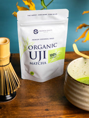 Organic Uji Matcha 40g pouch displayed with chasen and matcha bowl, premium ceremonial grade Japanese matcha