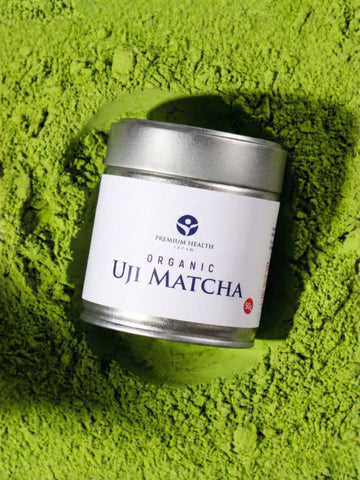 Organic Uji matcha 50 g jar on vivid green matcha powder background
