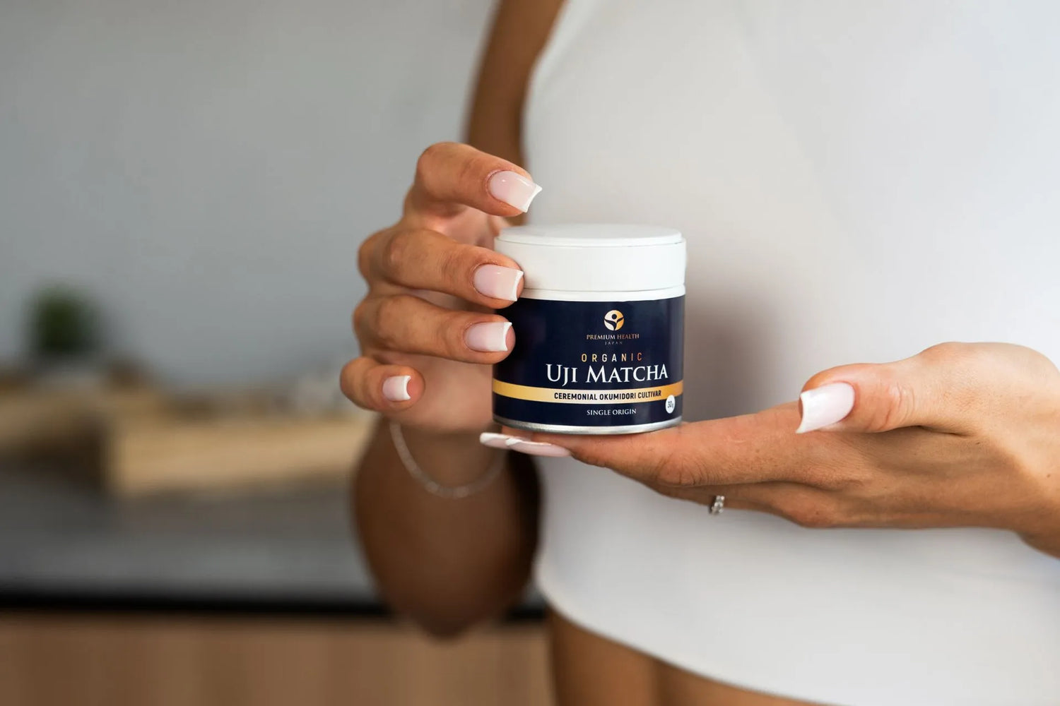 Organic Uji matcha made from the Okumidori cultivar, presented in a 30g ceremonial-grade tin and held in hand.