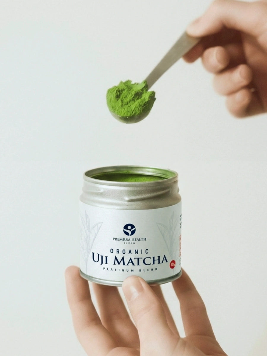 Hand holding Premium Health Japan organic Uji matcha platinum blend tin with matcha scoop