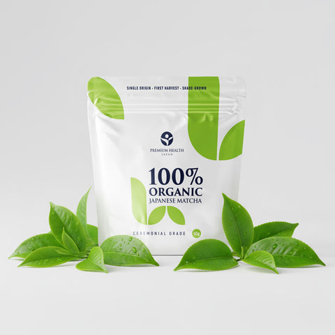 Organic Japanese matcha in a 50g pouch with fresh tea leaves on a white background, showcasing ceremonial grade packaging.