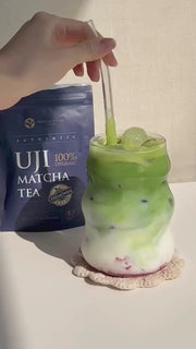 Preparing and iced matcha strawberry drink with milk