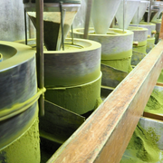 Stone grinders used in Uji, Japan to produce fine ceremonial-grade matcha powder using traditional slow-turning methods.