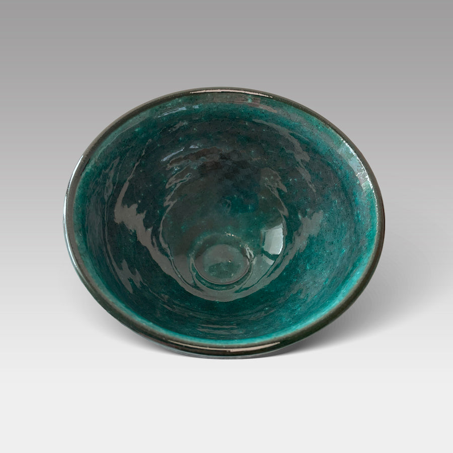 Top view of Japanese matcha chawan with glossy teal-glazed interior, handcrafted for traditional tea ceremony or daily use